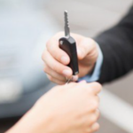 Fleet vehicle locksmith Atlanta handing over replacement car key