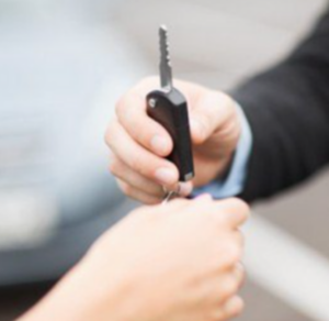 Fleet vehicle locksmith Atlanta handing over replacement car key