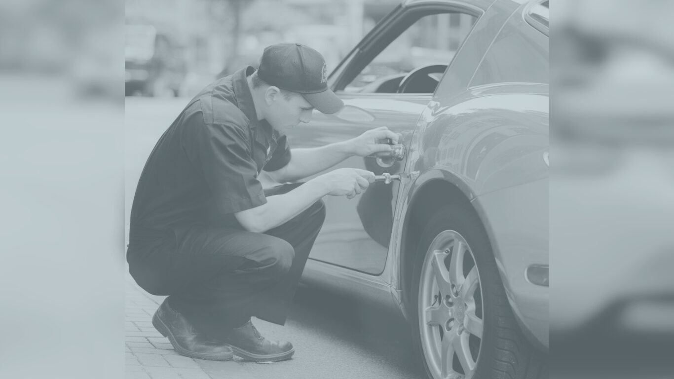 Fleet vehicle locksmith Atlanta technician repairing car door lock