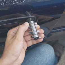 Fleet vehicle locksmith Atlanta performing lock repair on car door