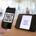 Scanning a VIN-linked QR code to order a replacement car key from AWL Keys