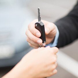 AWL Keys delivering a newly cut key to a customer after QR-based VIN order