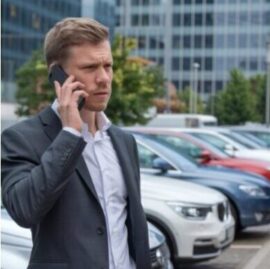 Businessman contacting fleet locksmith service for emergency key help in Atlanta